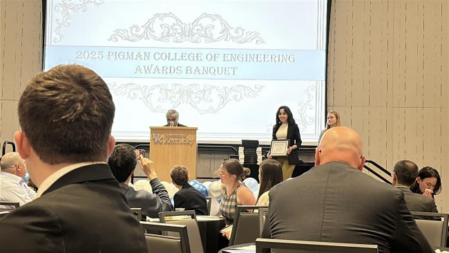 Faezeh Akbari holding her certification